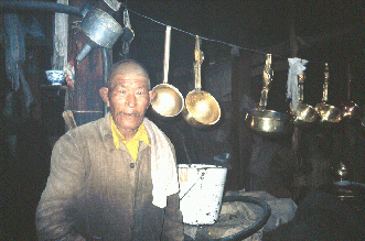 The "chef" at Phabhongkha, surrounded by ancient cookware