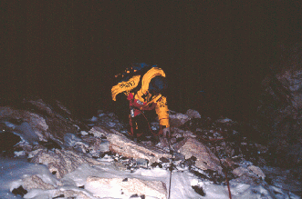 In the dark, going through the cliff band above Camp III