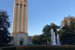 Sunlight shines on a tall tower at Stanford University Campus