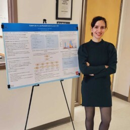 Sara Nurollahian standing next to a poster presenting the research described in the ICSE 2023 paper.